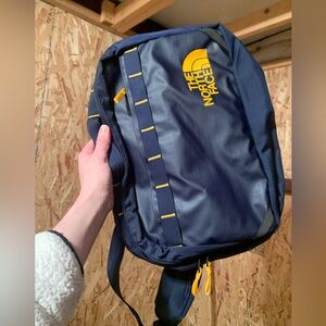 North Face Base Camp Voyager Sling backpack in Summit Navy/Summit Gold